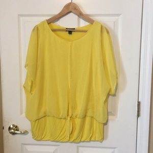 Woman’s yellow blouse